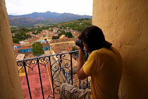 Shooting photos from a balcony in a village
