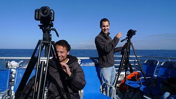 Wildlife boys on a boat with DSLRs